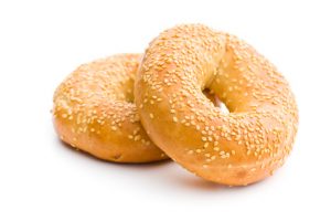 tasty bagel with sesame seed on white background