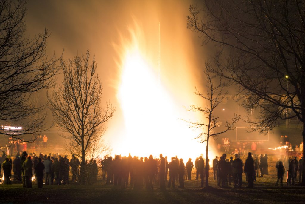 Big huge traditional fire. Burning of witches in a bonfire. Profane rites in Bavaria, Germany. Alps.